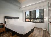Queen Guest Room with HDTV and City View