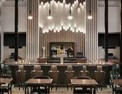 On-site bar featuring ample seating, stunning design, and delicious beverages.