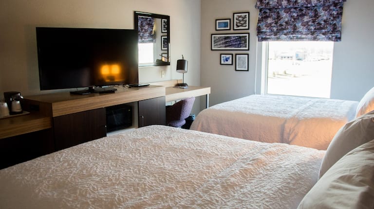 Two Queen Beds Guest Bedroom with HDTV and Work Desk