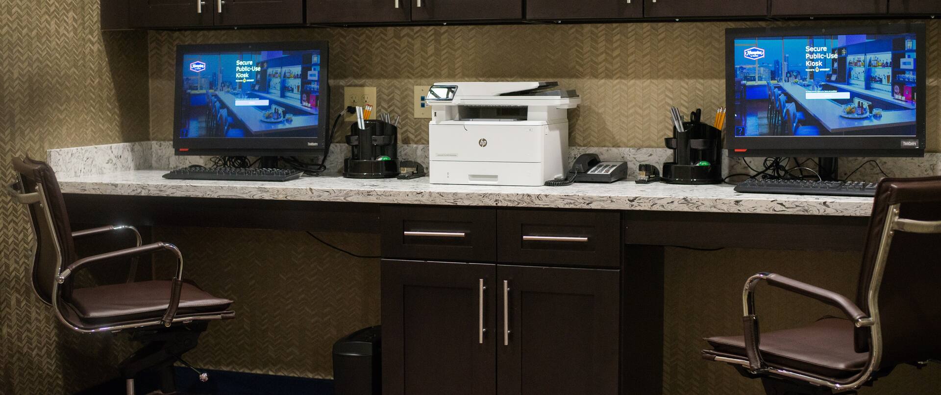 Business Center with Two Desktop Computers, Two Office Chairs and Printer