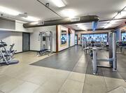 Cardio Equipment, Entry, Weight Machines, Wall Mirror, and Towel Station in Fitness Center