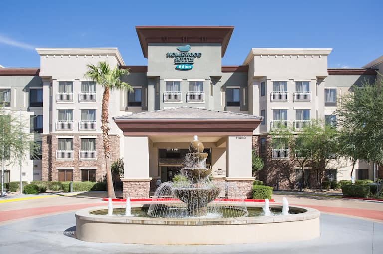 Front hotel exterior with circle drive and large fountain
