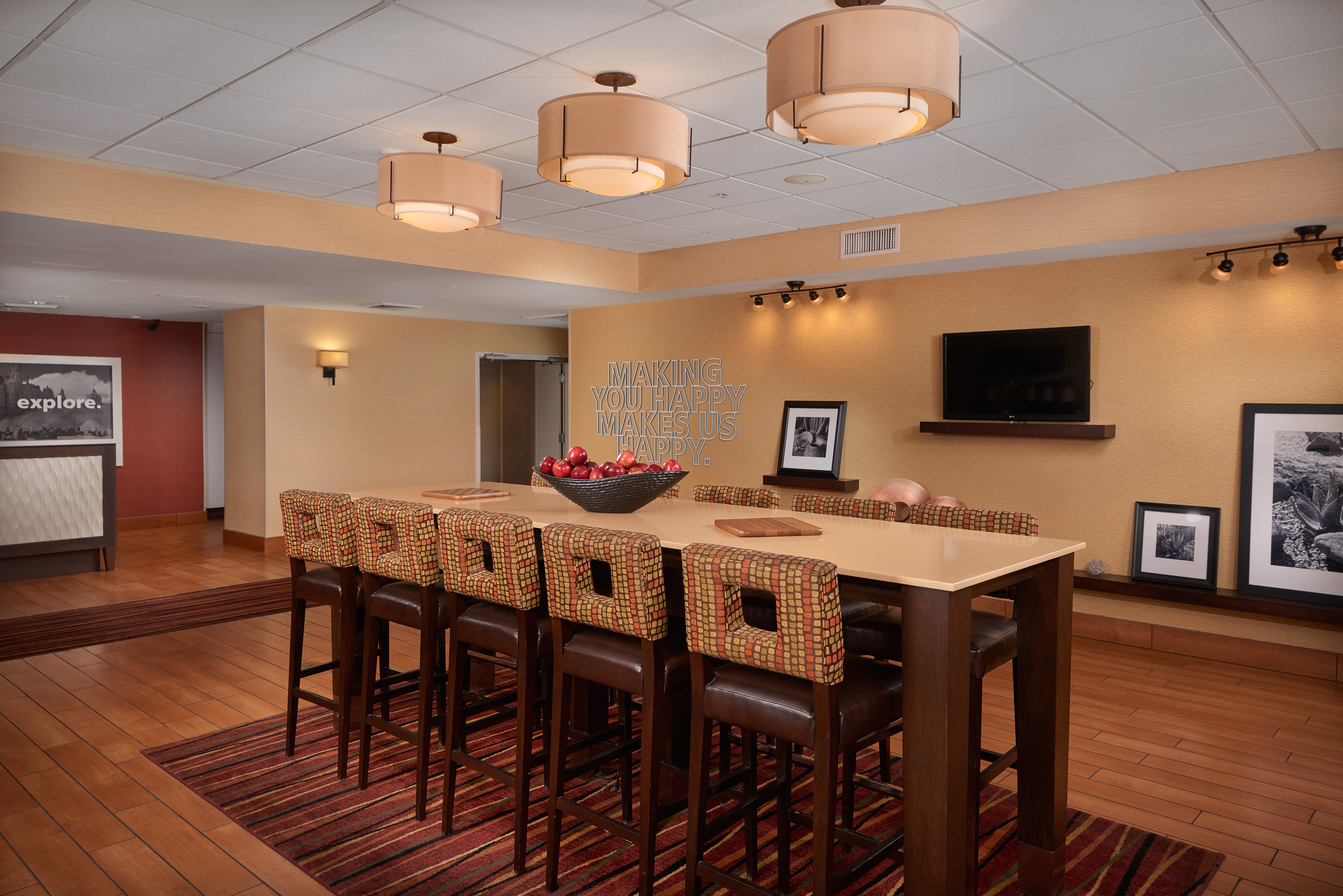 Lobby Seating Area with Tall Chairs, Tall Table and Wall Mounted HDTV