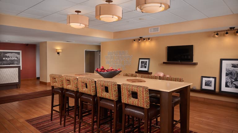 Lobby Seating Area with Tall Chairs, Tall Table and Wall Mounted HDTV