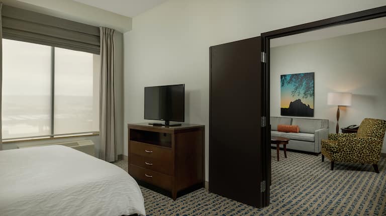 Accessible Guest Suite with King Bed, Television and Living Room Area