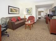 Guestroom Deluxe Suite with Work Desk, Lounge Area, and Room Technology