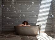 View of woman in spa bathtub
