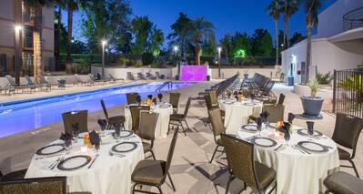 Poolside Restaurant Dining Tables and Chairs with a View Palm Trees