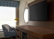 Guestroom with Work Desk Lamp and Television