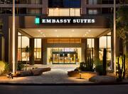Hotel Entrance Exterior with Embassy Suites Sign at Night