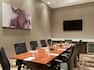 Meeting Room with Large Meeting Table, Office Chairs and Wall Mounted HDTV