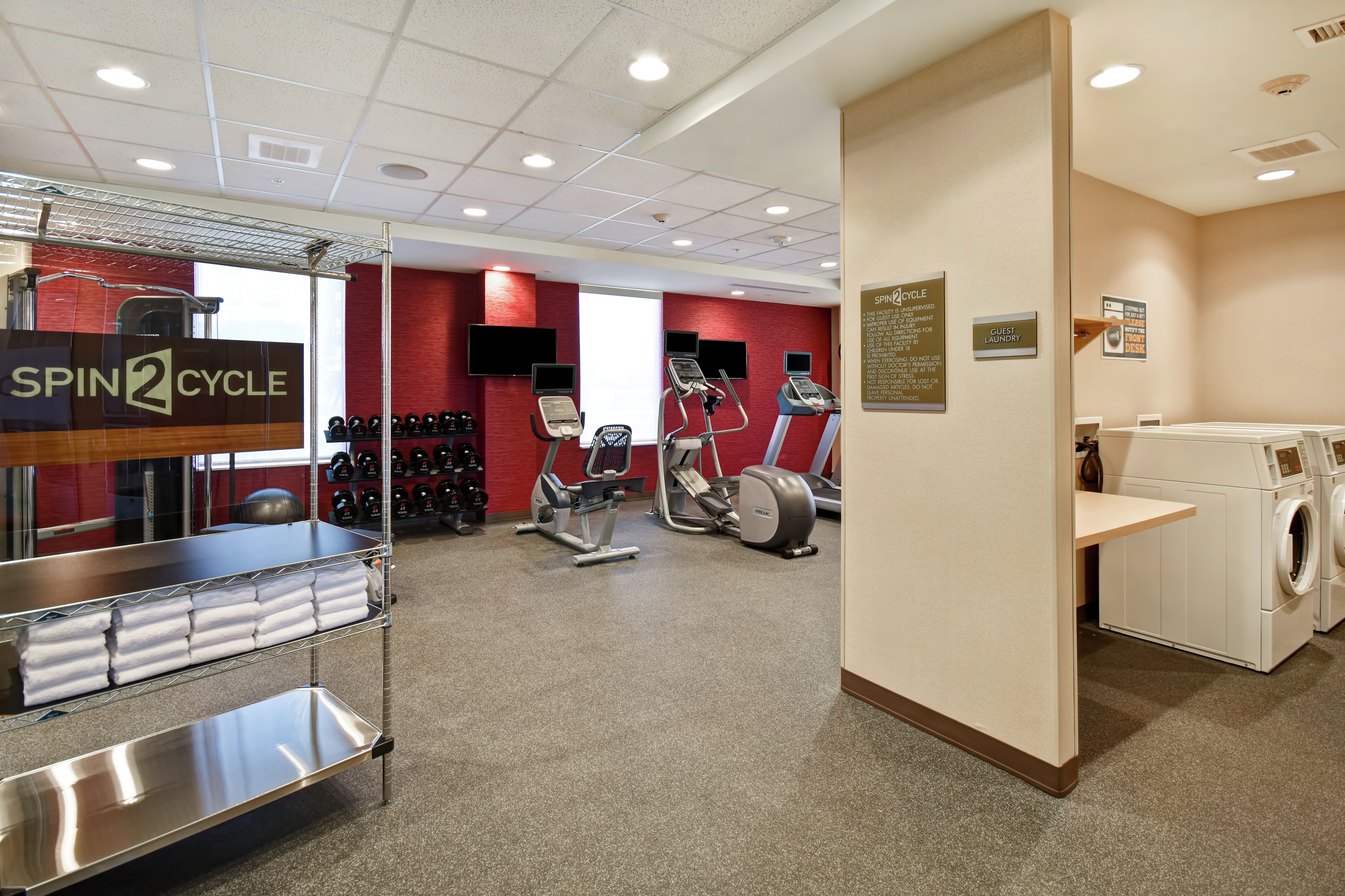 Fitness Room with Workout Equipment and Guest Washer and Dryer