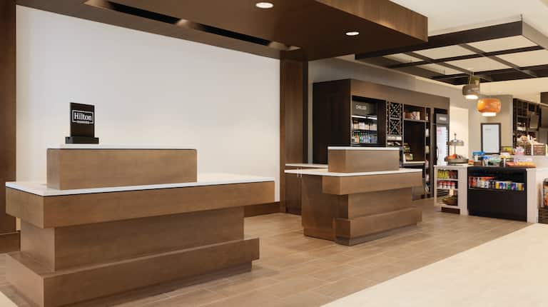 Front Desk Reception Area with Snack Shop in Background