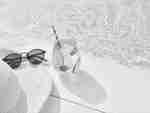 Daytime Shot of Drink from Slim Picken's Next to Sunglasses and Hat