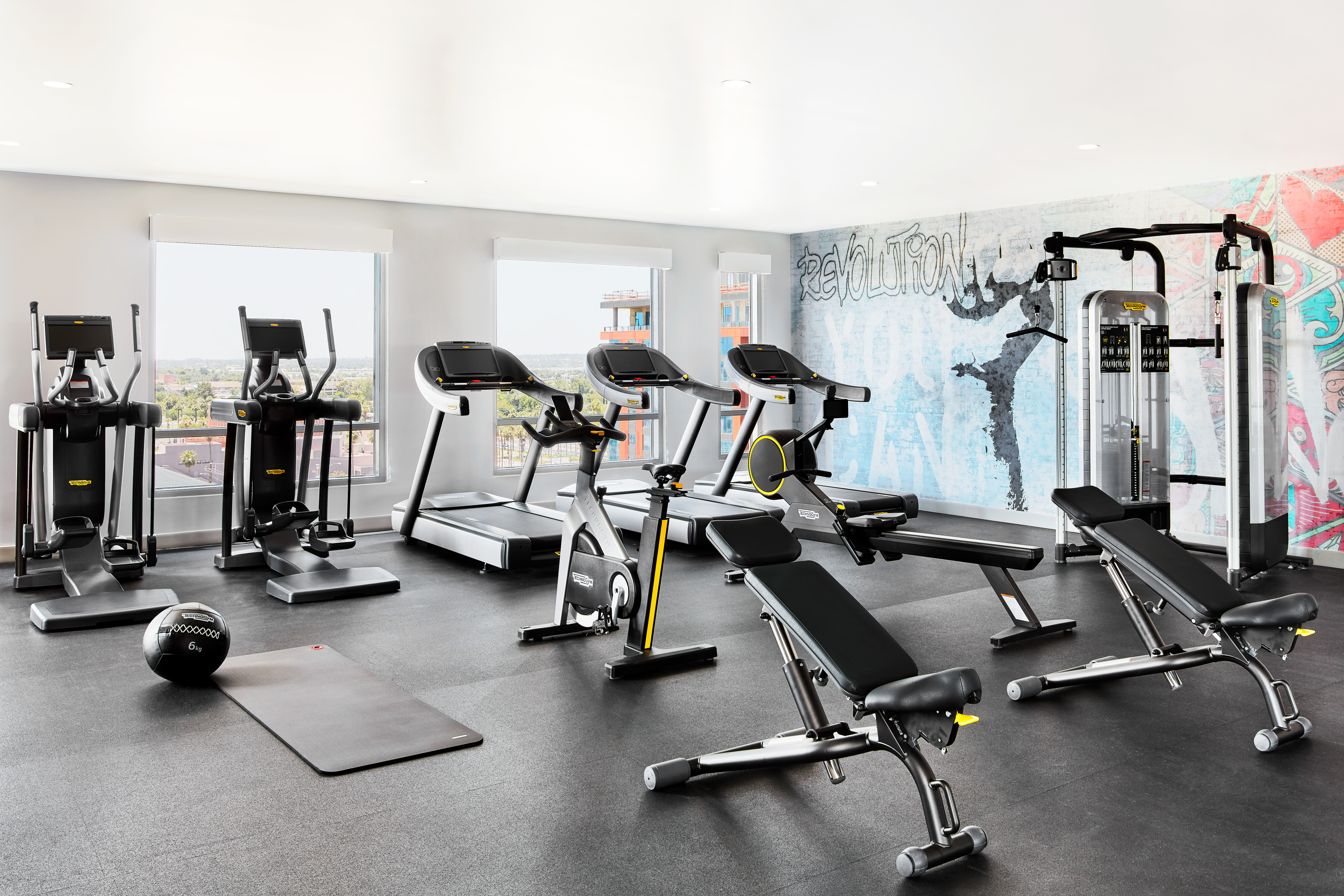 Fitness center with cardio machines and benches