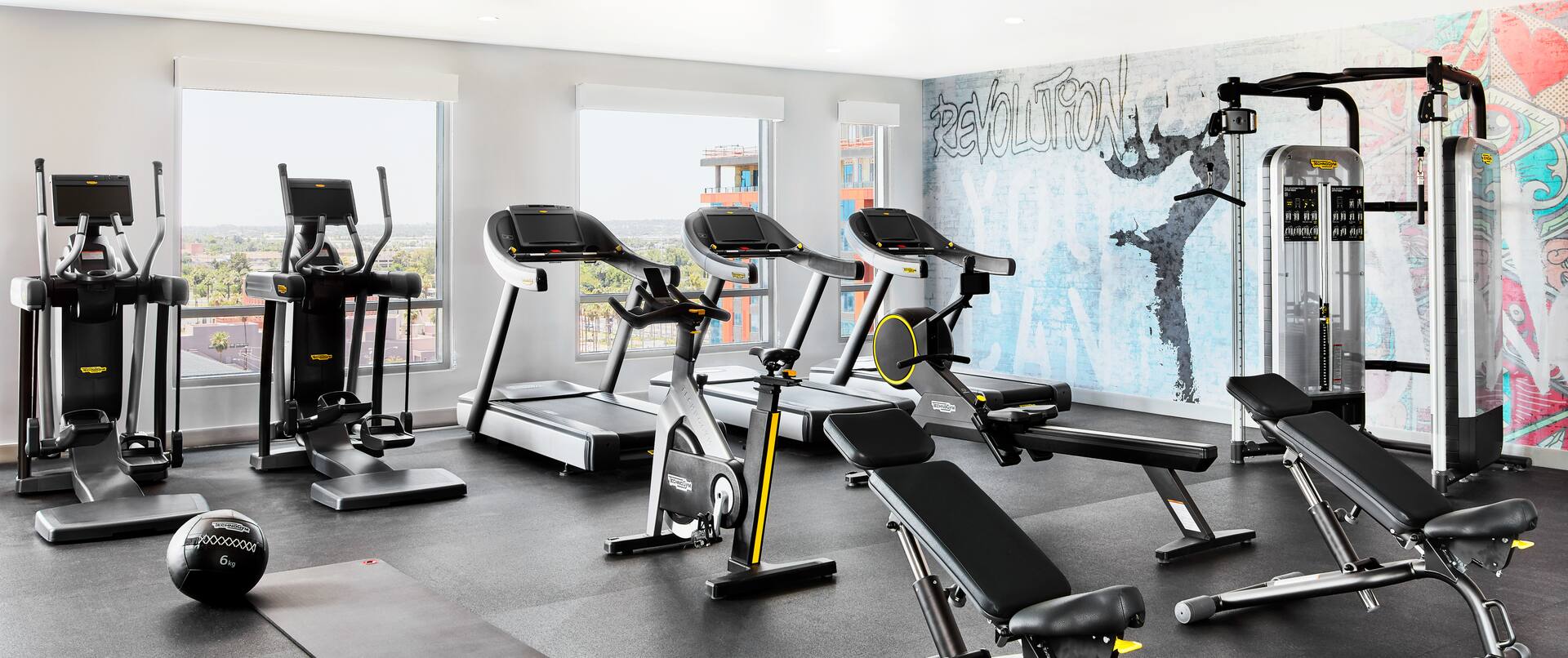 Fitness center with cardio machines and benches