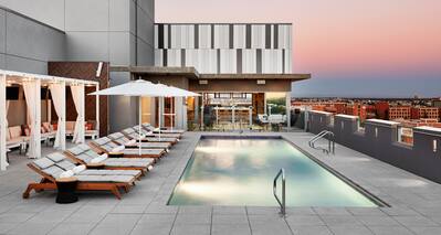 Rooftop pool with loungers