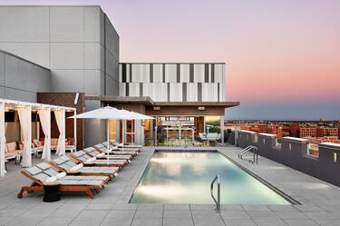 Rooftop pool with loungers