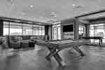 lobby lounge area with pool table and television