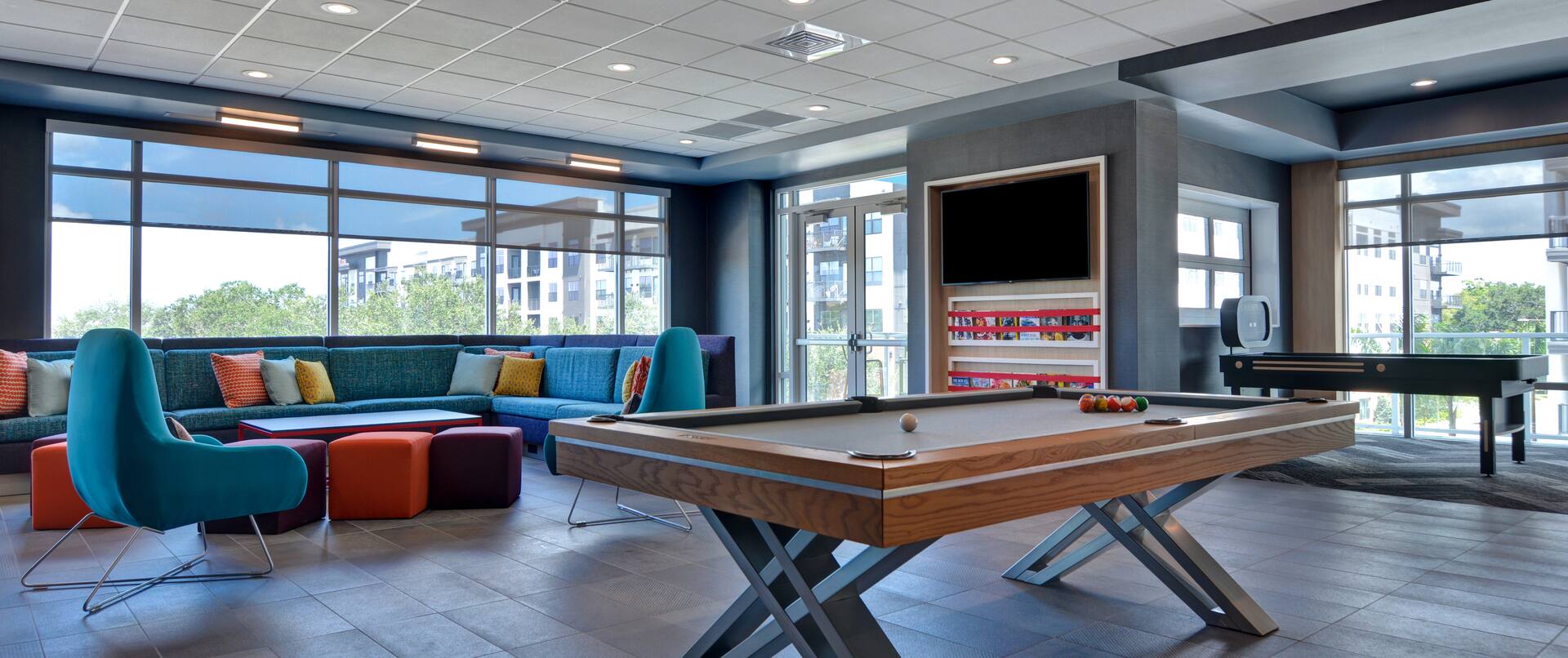 lobby lounge area with pool table and television