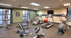 Exercise Equipment and Flat Screen TV in Fitness Center
