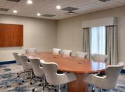 Meeting Room With Conference Table, Chairs, and Whiteboard