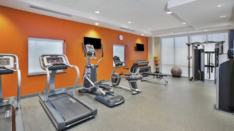 Fitness Center with Treadmills Recumbent Bike and Weights