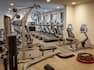 Fitness Center With Towel Station, TV, Cardio Equipment, Facing Windows With Outside View, Aerobic Stepper, and Weight Machine