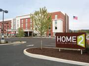 Daytime View of Extended Stay Cranberry PA Hotel Signage, Landscaping, Parking Lot, Hotel Exterior, Entrance and Flagpole