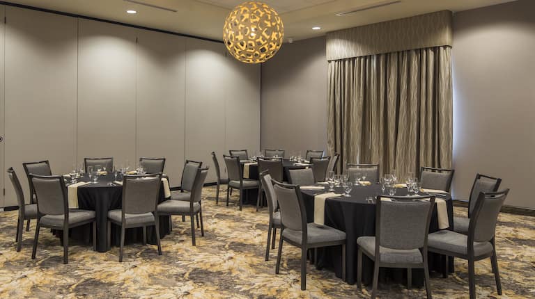Spacious Ballroom with Round Dining Tables and Chairs
