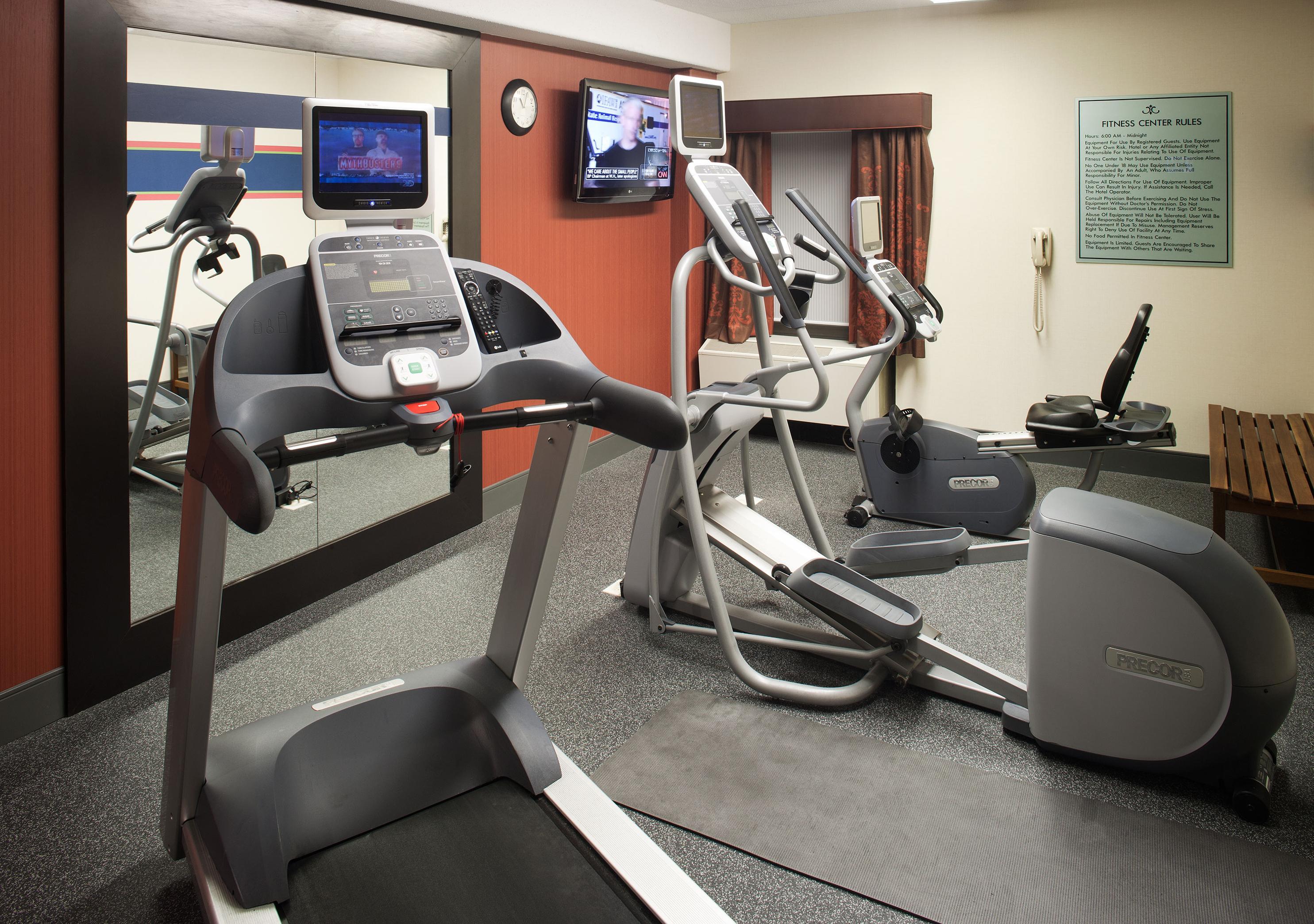 Fitness Center with Treadmill, Elliptical Machine, Room Technology, and Mirror
