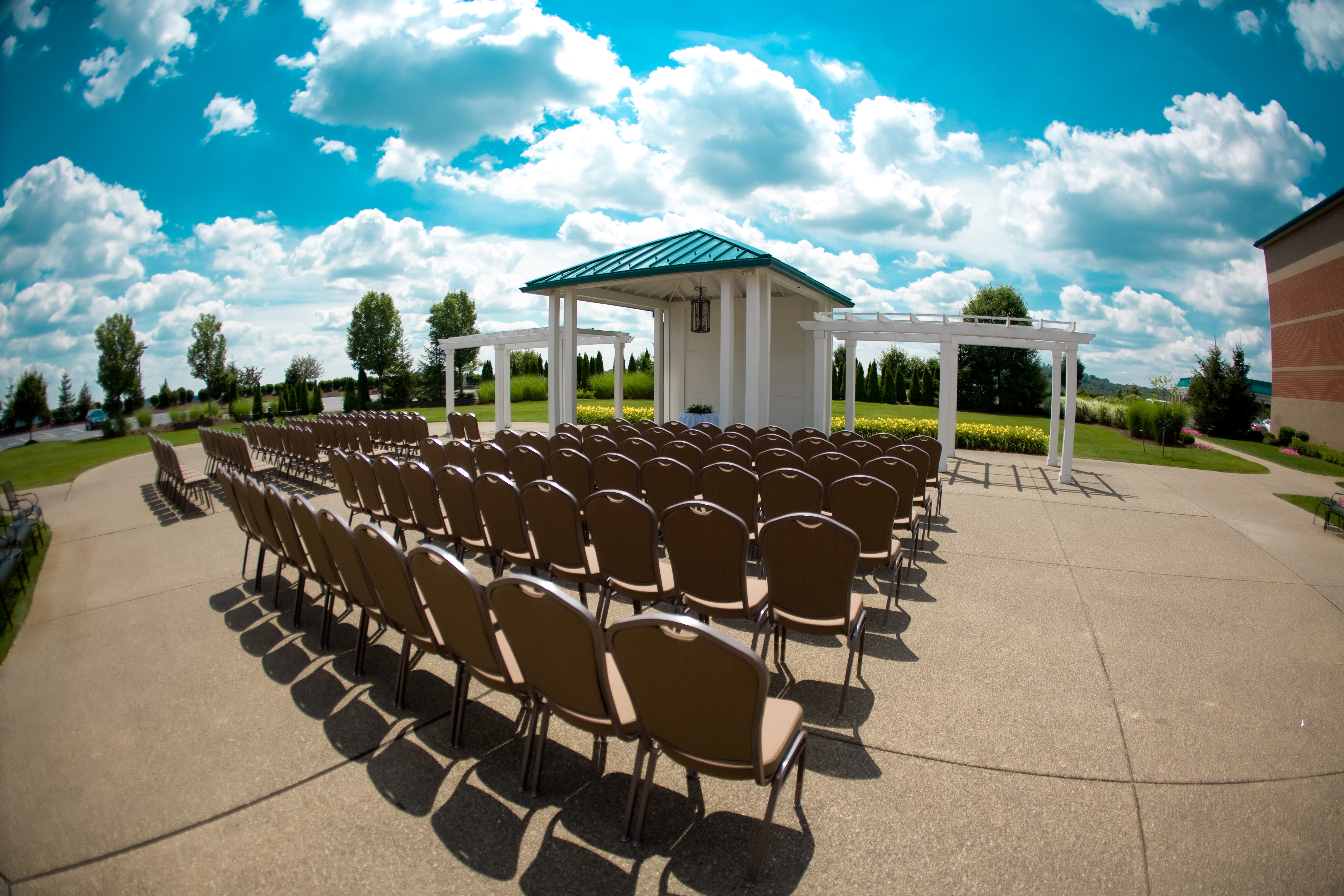 CHairs Arranged Theater Style in Courtyard for Outdoor Wedding