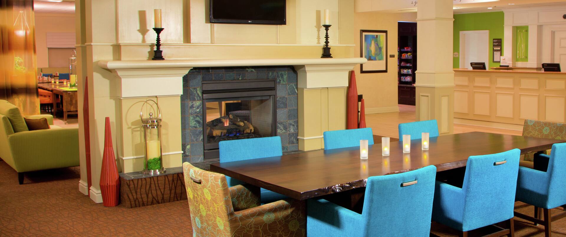 Seating for 8 at Lobby Conservatory Table in Lobby By Fireplace and TV