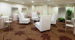 Wedding Setup with Soft Chairs and Round Tables