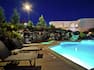 Outdoor Swimming Pool and Patio in the Evening