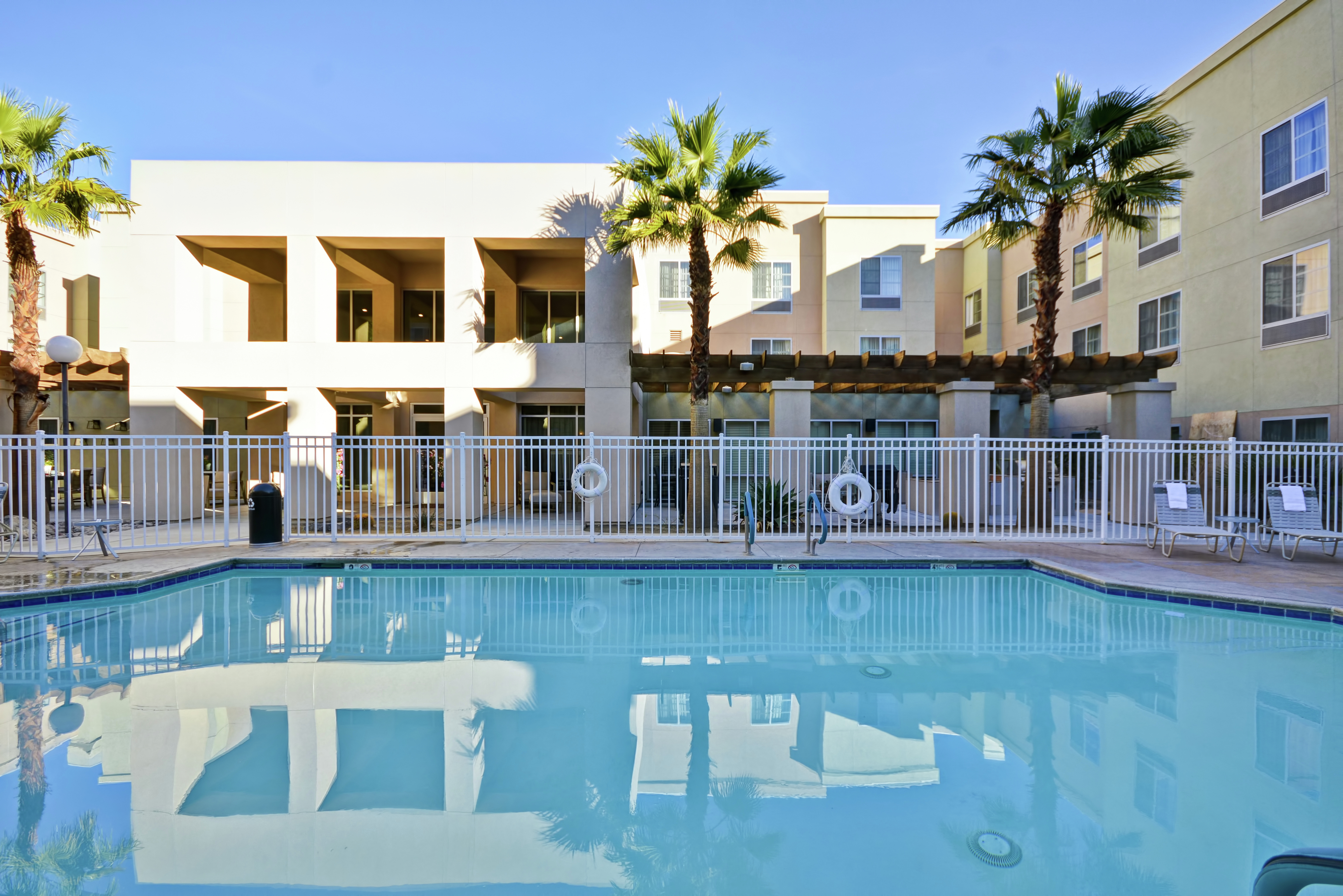 Daytime View of Outdoor Pool and Hotel Exterior