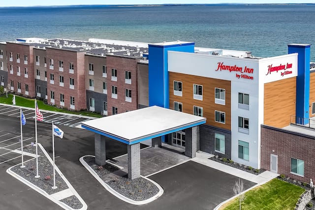 aerial view showing front of building with view of water