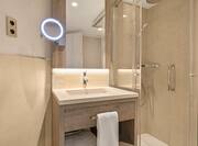 Bathroom with vanity and shower
