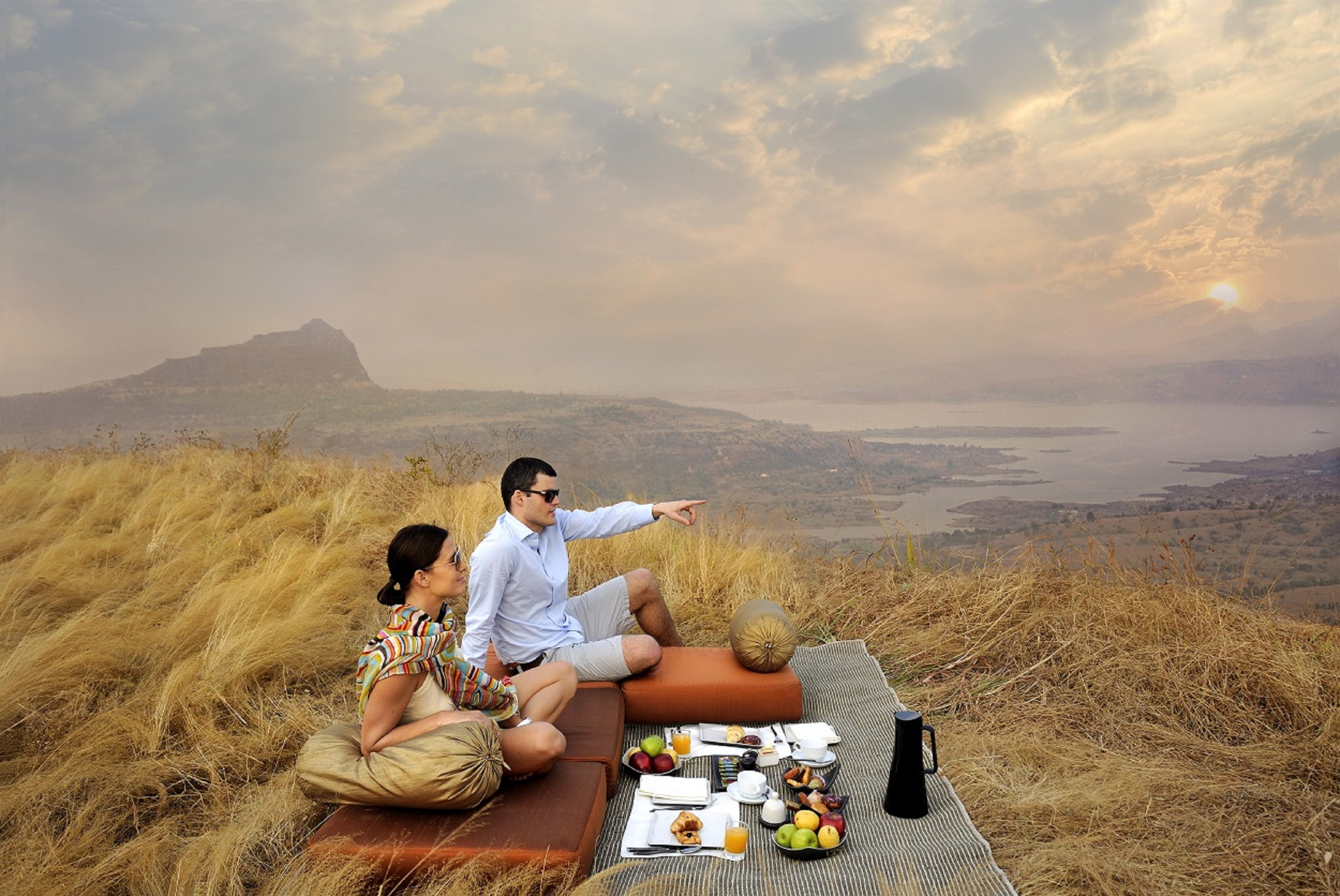 Couple Enjoying Breakfast On A Mountain