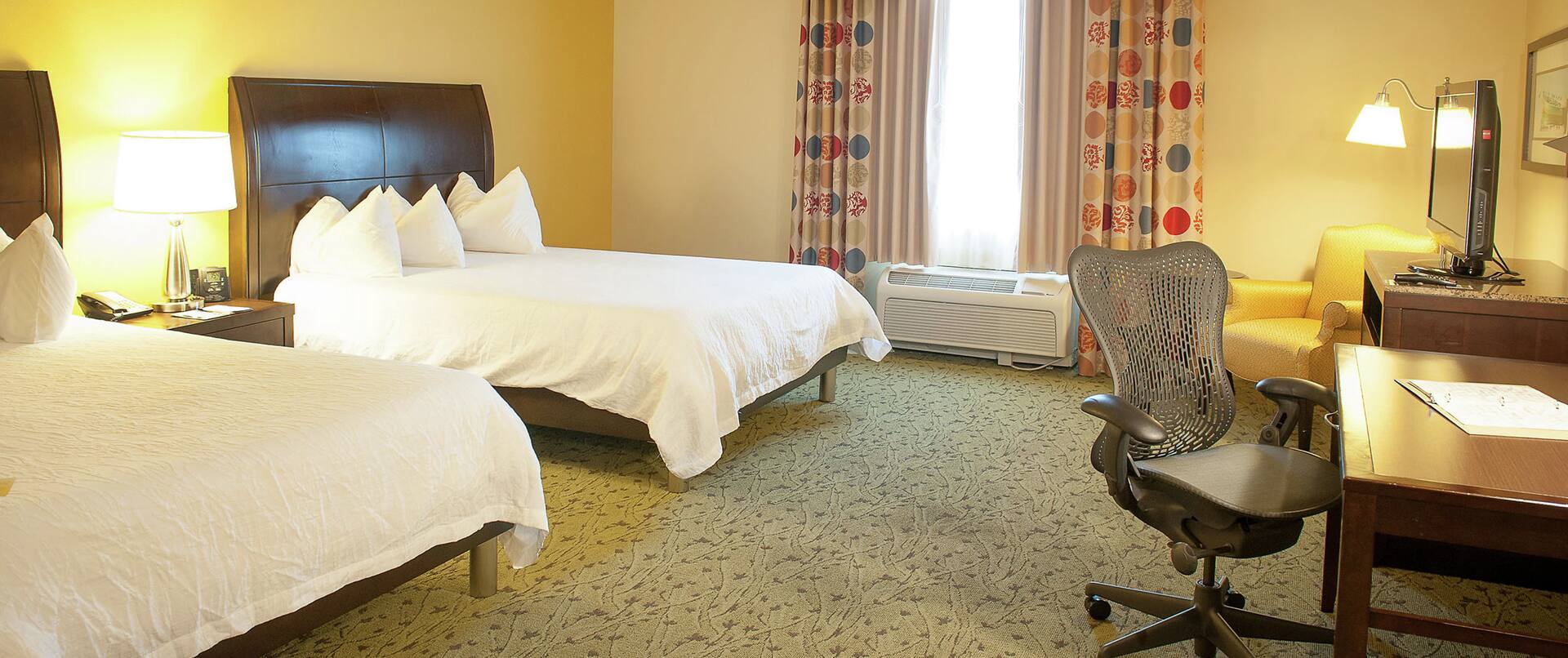 Accessible Guestroom with Two Queen Beds, Lounge Area, Work Desk, and Room Technology
