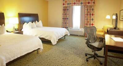 Accessible Guestroom with Two Queen Beds, Lounge Area, Work Desk, and Room Technology