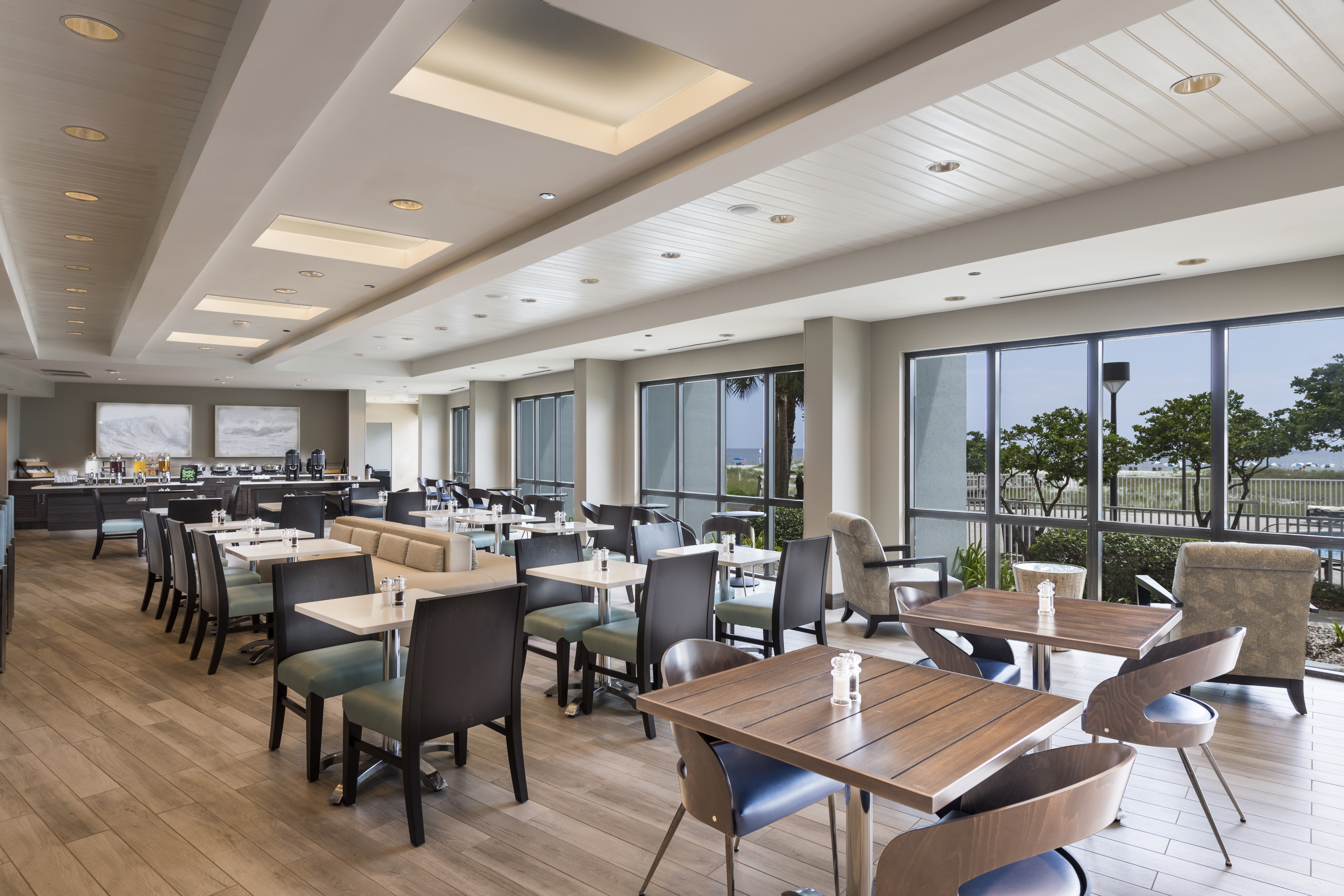 Long Shot of Seating in the Bistro Dining Facing the Buffet Area with an Outside View
