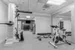 Fitness Center with Cycle Machine, Weight Machine and Weight Bench