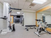 Fitness Center with Cycle Machine, Weight Machine and Weight Bench