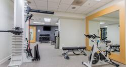 Fitness Center with Cycle Machine, Weight Machine and Weight Bench