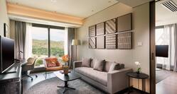 Executive Suite Living Area with Sofa, Armchair, Coffee Table, Work Desk and HDTV