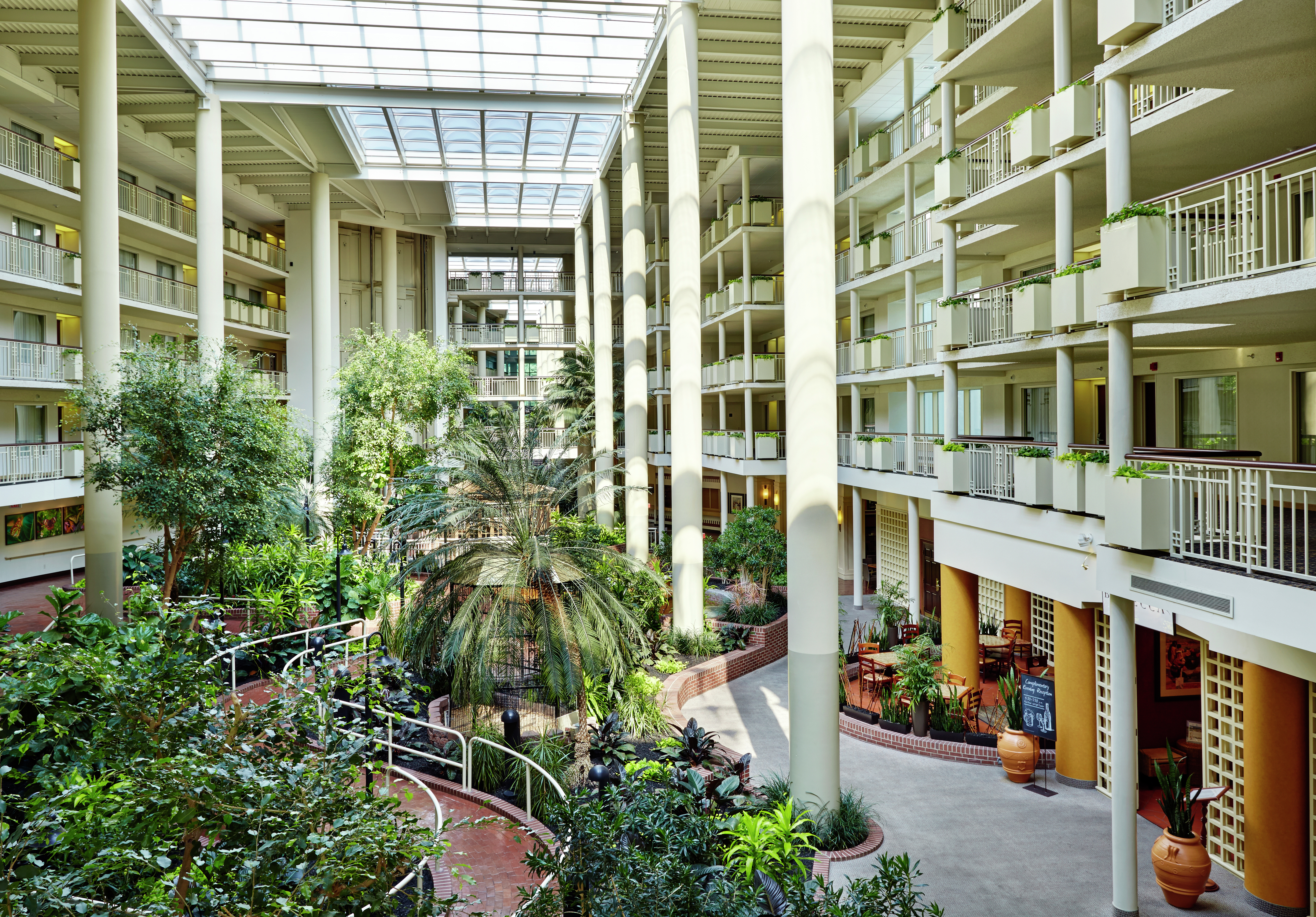 Hotel Atrium with Overlooking Balconies and Foliage