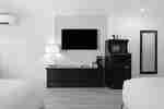 Two queen beds and television area
