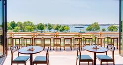 Covered and Uncovered Patio Dining Options With of Lake