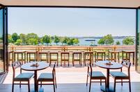 Covered and Uncovered Patio Dining Options With of Lake